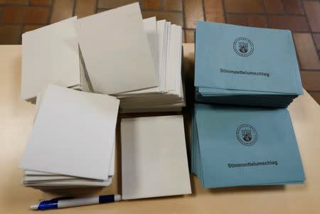 Ballot papers are pictured during regional elections at a polling station in Bad Kreuznach, in the German federal state of Rhineland-Palatinate, March 13, 2016. REUTERS/Kai Pfaffenbach