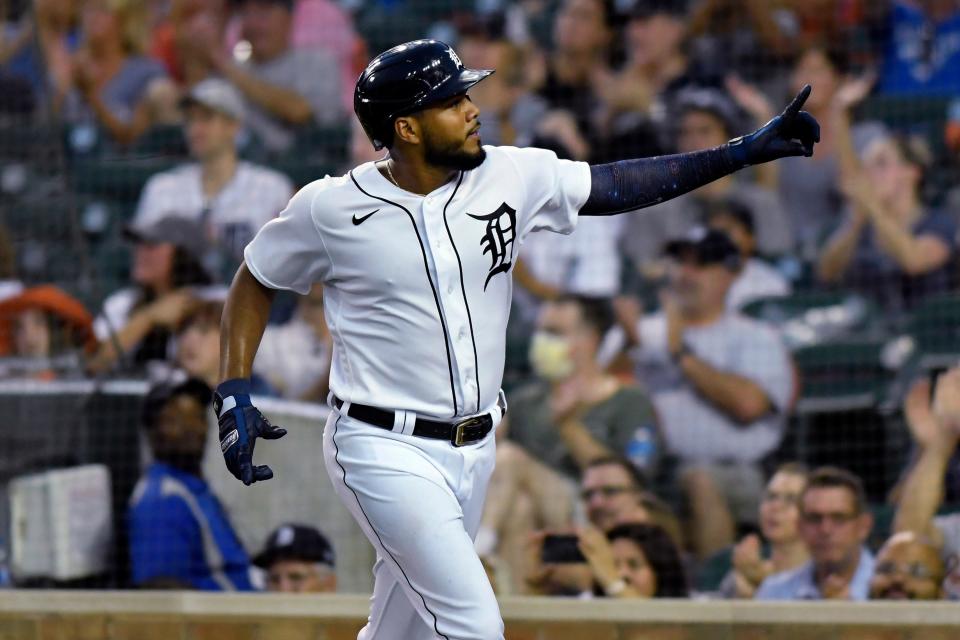 Detroit Tigers' Jeimer Candelario points to the crowd after scoring against the Toronto Blue Jays during the fourth inning of a baseball game Friday, Aug. 27, 2021, in Detroit.