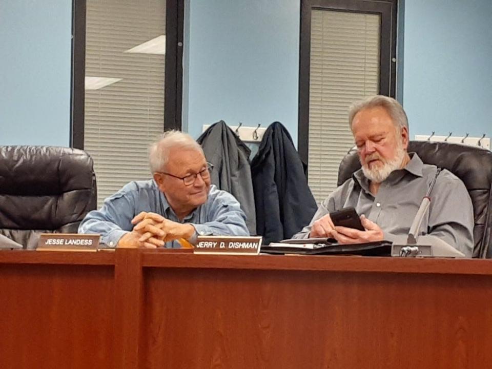 Delaware County-Muncie Plan Commission members Jesse Landess (left) and Jerry Dishman chat before the start of the commission meeting that saw a new solar ordinance take effect in Delaware County.