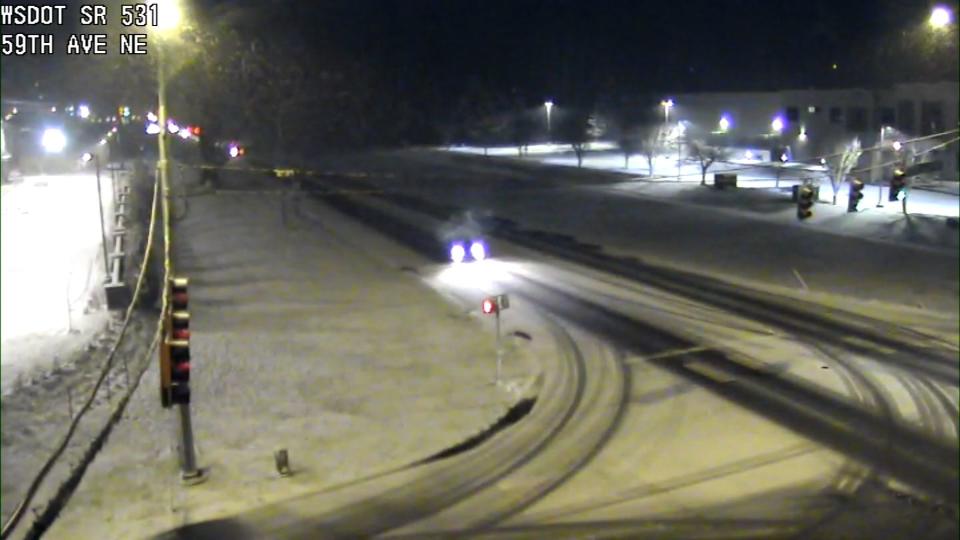 Washington State Department of Transportation cameras showed snow falling around Western Washington Wednesday.