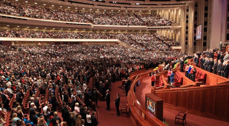 People gather inside the Conference Center during the 184th Annual General Conference of The Church of Jesus Christ of Latter-day Saints Saturday, April 5, 2014, in Salt Lake City. More than 100,000 Latter-day Saints are expected in Salt Lake City this weekend for the church's biannual general conference. Leaders of The Church of Jesus Christ of Latter-day Saints give carefully crafted speeches aimed at providing members with guidance and inspiration in five sessions that span Saturday and Sunday. They also make announcements about church statistics, new temples or initiatives. In addition to those filling up the 21,000-seat conference center during the sessions, thousands more listen or watch around the world in 95 languages on television, radio, satellite and Internet broadcasts. (AP Photo/Rick Bowmer)