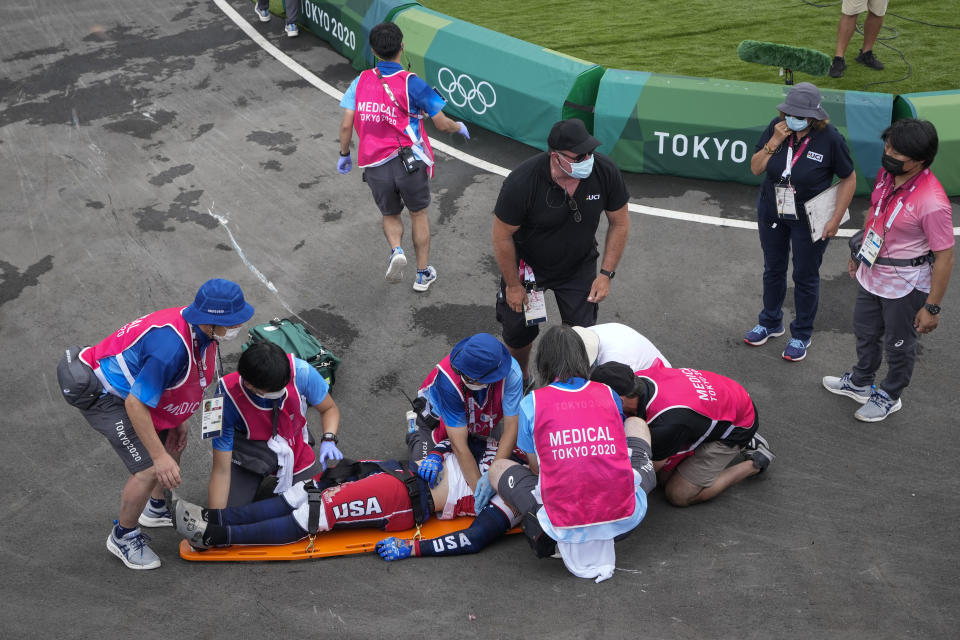 FILE - Medics prepare to carry Connor Fields, of the United States, away on a stretcher after he crashed in the men's BMX Racing semifinals at the 2020 Summer Olympics, Friday, July 30, 2021, in Tokyo, Japan. His injuries were numerous: torn shoulder ligaments, a torn bicep, broken ribs, a collapsed lung. But most serious was what was diagnosed as a subarachnoid hemorrhage and subdural hematoma — essentially, bleeding on the brain. (AP Photo/Ben Curtis, File)