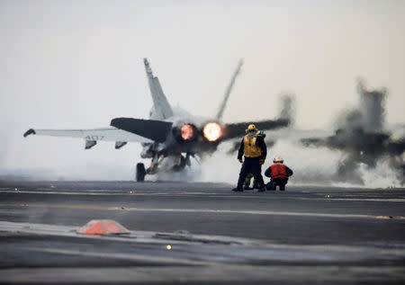 A U.S. Navy F18 fighter jet takes off from the deck of U.S. aircraft carrier USS Carl Vinson during an annual joint military exercise called "Foal Eagle" between South Korea and U.S., in the East Sea, South Korea, March 14, 2017. REUTERS/Kim Hong-Ji