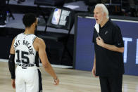 San Antonio Spurs head coach Gregg Popovich talks with Quinndary Weatherspoon (15) during the second half of an NBA basketball game against the Utah Jazz, Friday, Aug. 7, 2020, in Lake Buena Vista, Fla. (Kevin C. Cox/Pool Photo via AP)