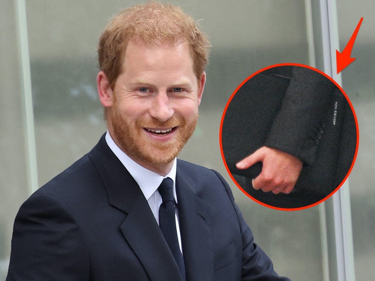 A photo of Prince Harry smiling with an inset of a folio engraved with "Archie's Papa."