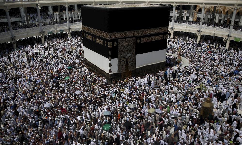 Muslim pilgrims walk around the Kaaba at the Grand Mosque of Mecca