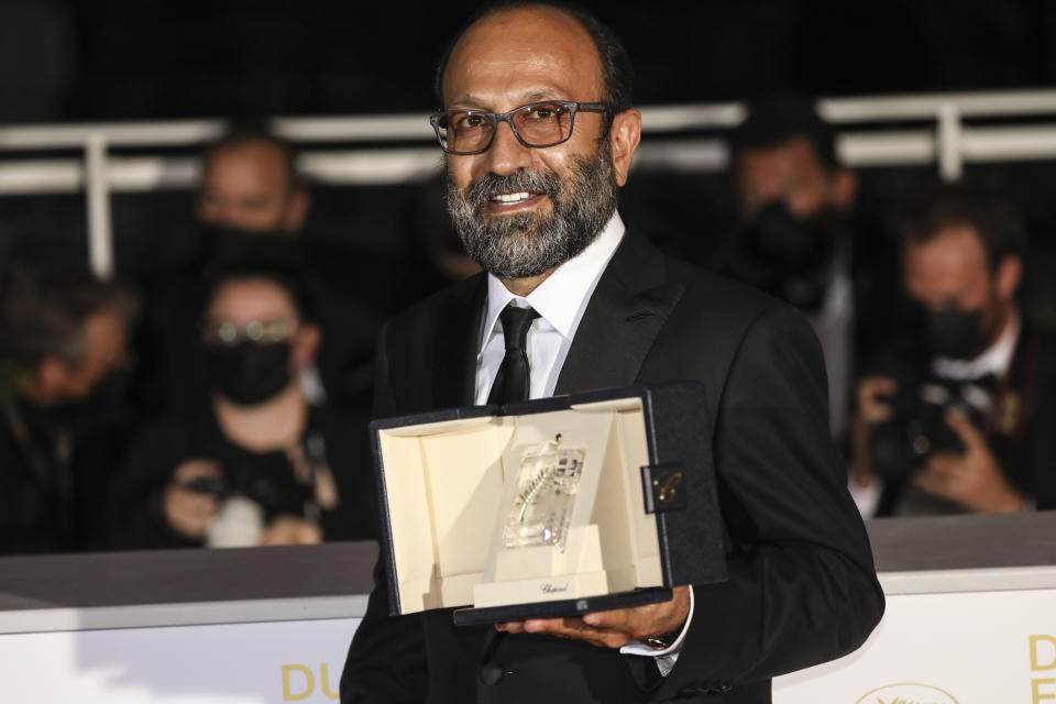 Asghar Farhadi, winner of the grand prix award for the film 'A Hero' poses for photographers during a photo call following the awards ceremony at the 74th international film festival, Cannes, southern France, Saturday, July 17, 2021. (Photo by Vianney Le Caer/Invision/AP)