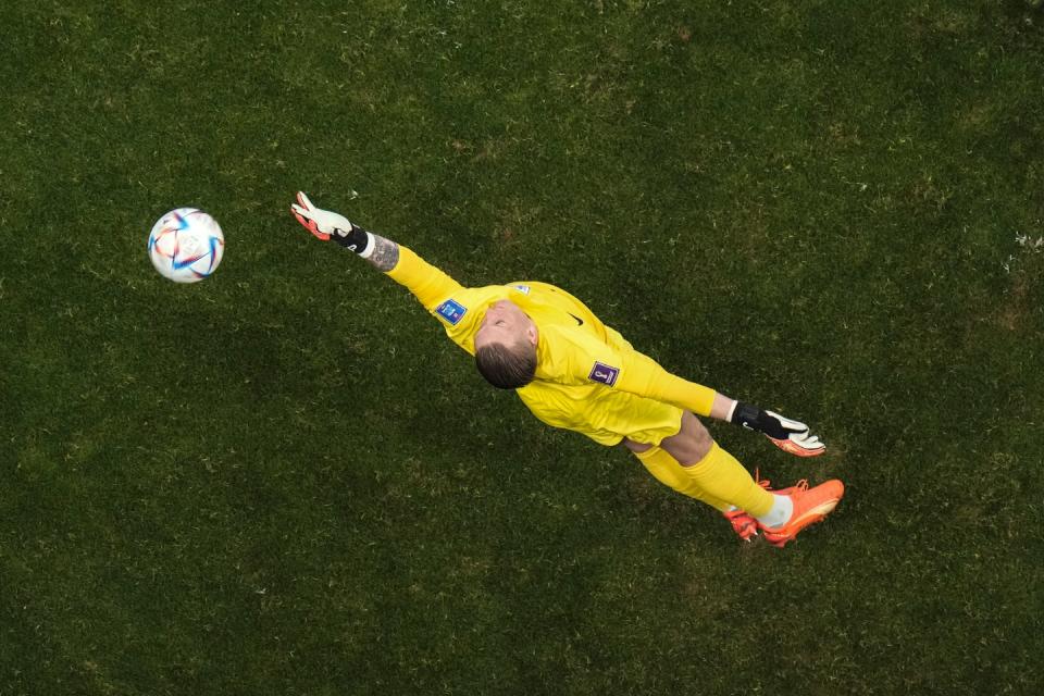 England's goalkeeper Jordan Pickford clears the ball during the World Cup group B football match between England and The United States, at the Al Bayt Stadium in Al Khor, Qatar, Friday, Nov. 25, 2022. (AP Photo/Hassan Ammar)