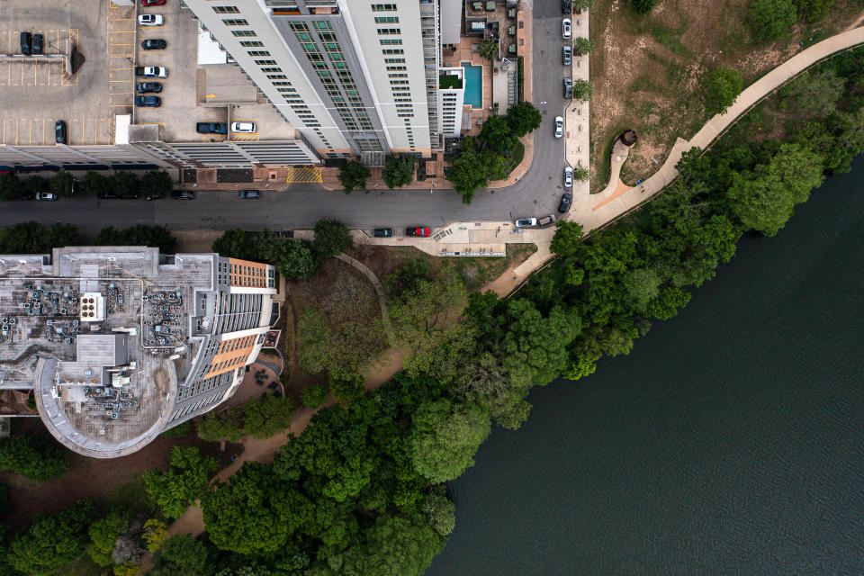 A hike and bike trail along Lady Bird Lake is feet from the end of Rainey Street on Sunday April 2, 2023 in Austin, Texas.