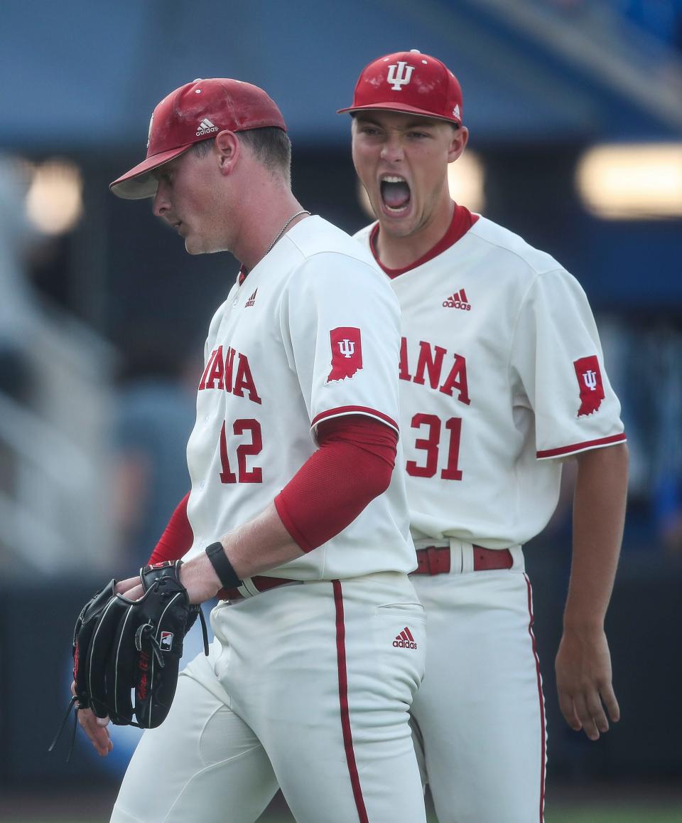 Indiana pitcher Craig Yoho gets encouragement from teammate Evan Whitaker during the game against UK. The Hoosiers defeated Kentucky 5-3 Saturday night in the 2023 NCAA Regional at Kentucky Proud Park in Lexington. June 3, 2023. 