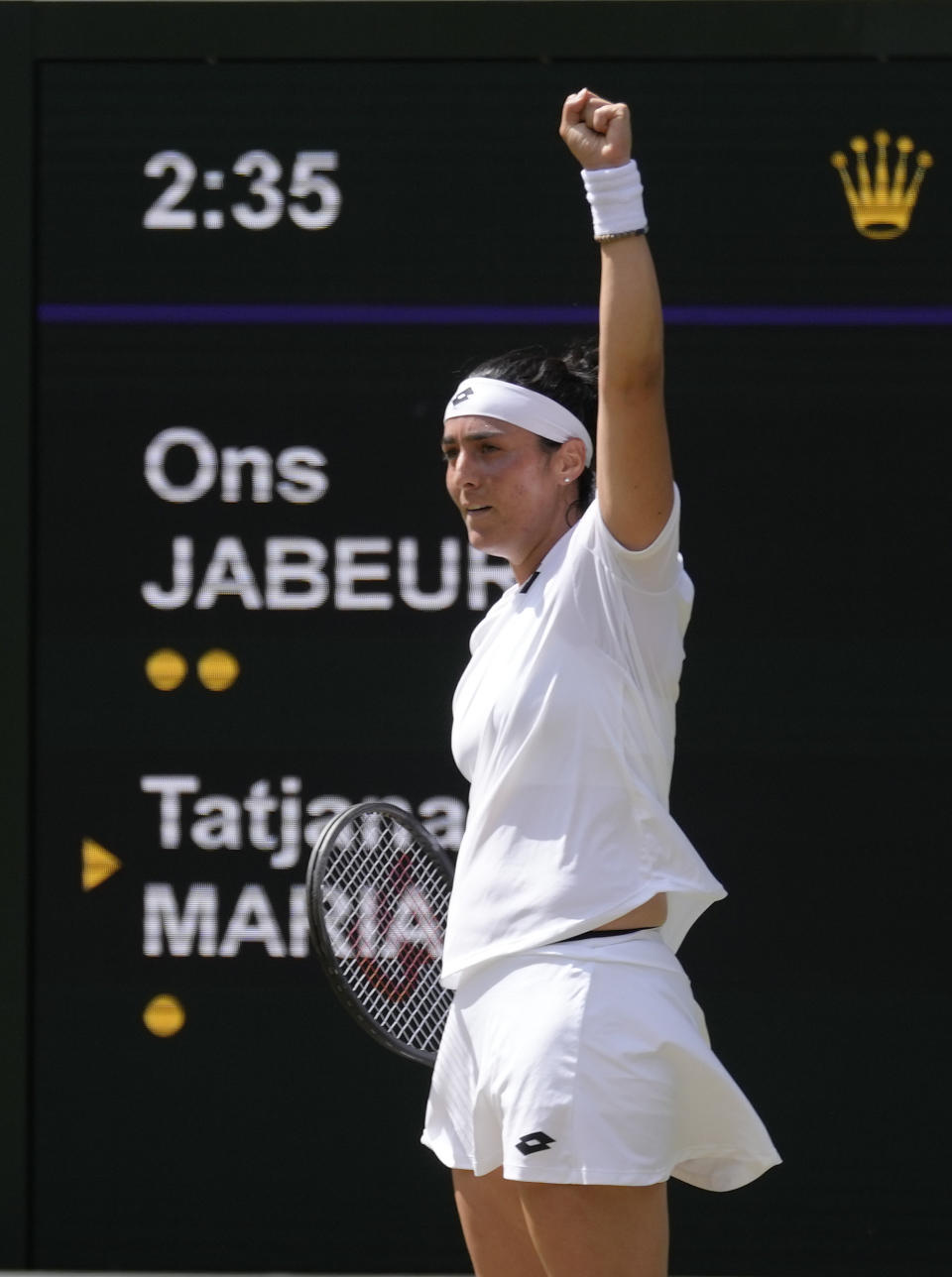 Tunisia's Ons Jabeur celebrates winning a point against Germany's Tatjana Maria in a women's singles semifinal match on day eleven of the Wimbledon tennis championships in London, Thursday, July 7, 2022. (AP Photo/Kirsty Wigglesworth)