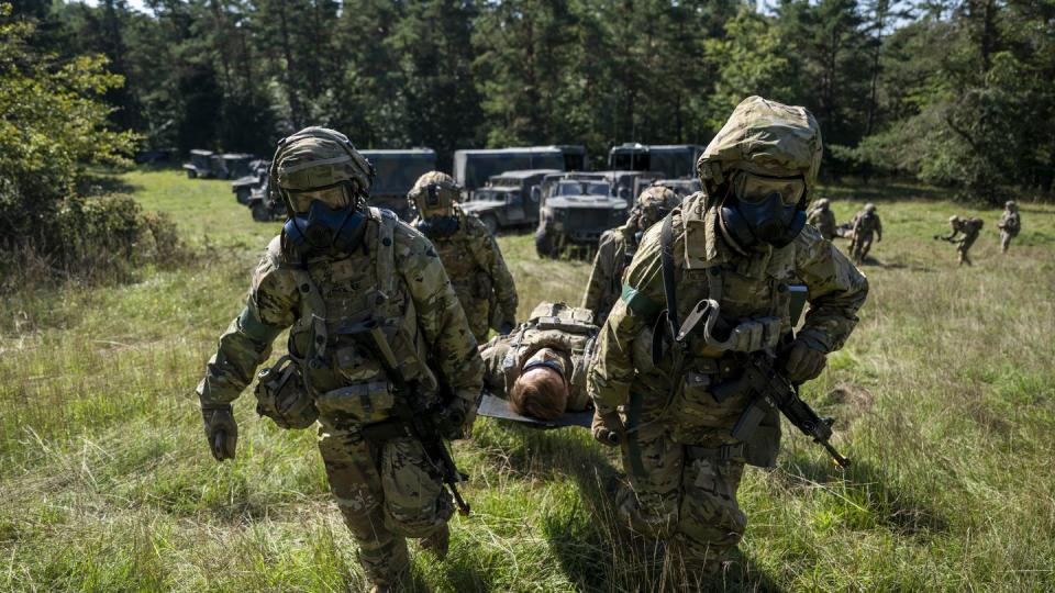 U.S. soldiers from the Field Artillery Squadron, 2nd Cavalry Regiment as well as British soldiers respond to a chemical attack during the exercise Saber Junction at the Joint Multinational Readiness Center near Hohenfels, Germany, on Sept. 14, 2023. (1st Sgt. Michel Sauret/Army)