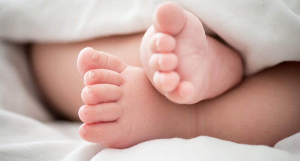 Baby feet after dad killed four-month-old son in Queensland.