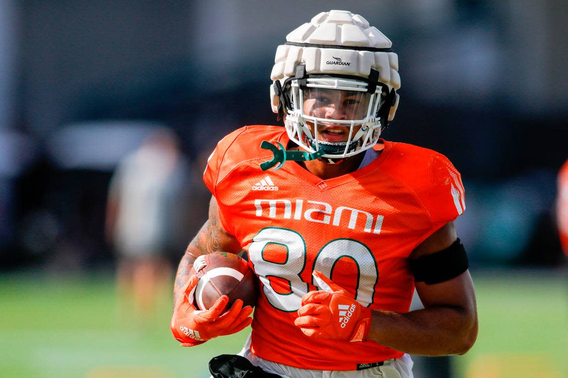 Miami Hurricanes tight end Elijah Arroyo (80) runs with the football during football practice at the University of Miami campus in Coral Gables, Florida, Tuesday, August 23, 2022.