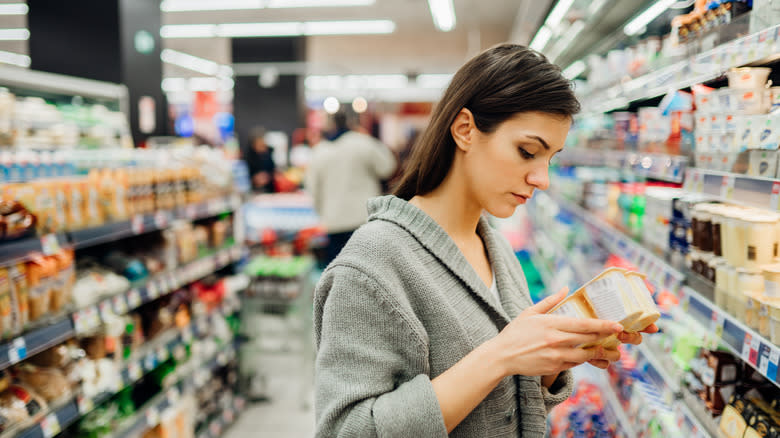 Woman reading nutritional information