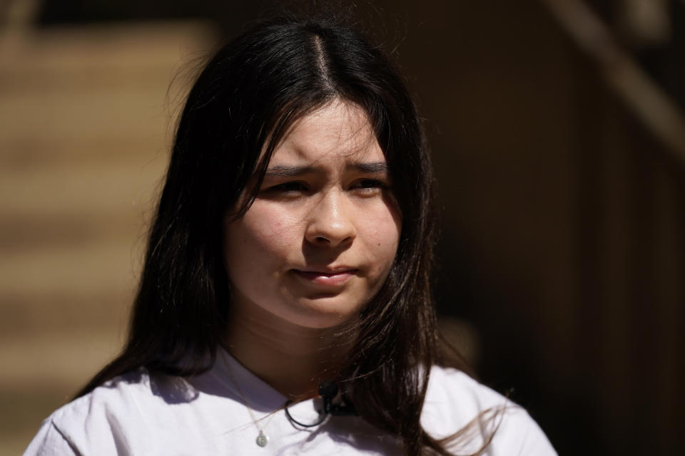 Upper Darby High School student Elise Olmstead, 16, pauses while speaking with a reporter during an interview in the campus courtyard, Wednesday, April 12, 2023, in Drexel Hill, Pa. For some schools, the pandemic allowed experimentation to try new schedules. Large school systems including Denver, Philadelphia and Anchorage, Alaska, have been looking into later start times. (AP Photo/Matt Slocum)