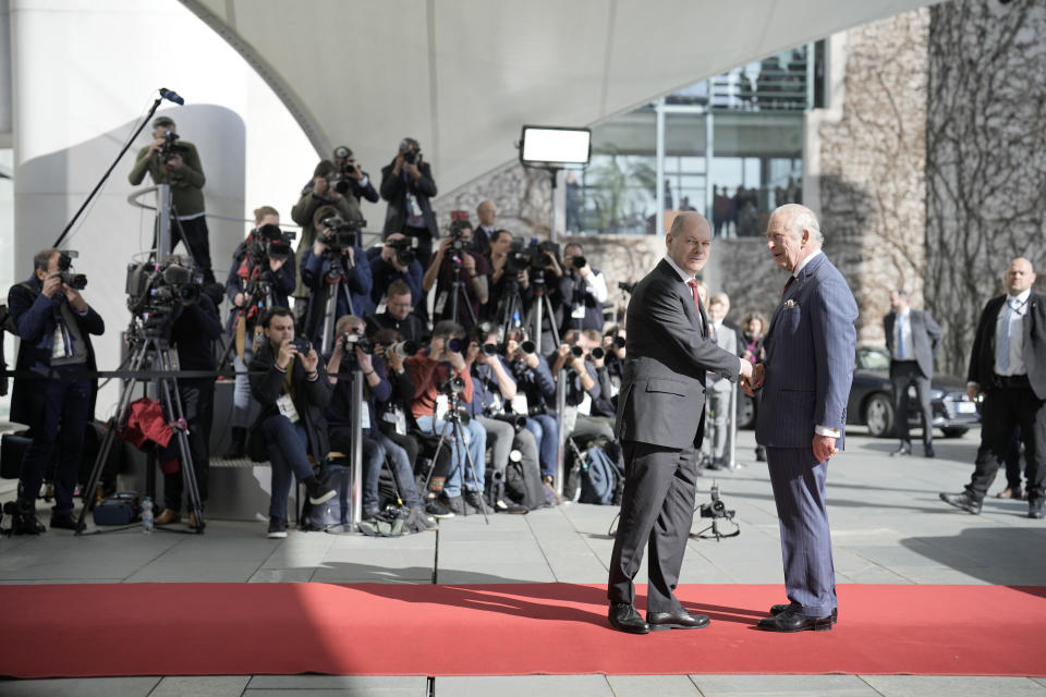 German Chancellor Olaf Scholz welcomes Britain's King Charles III at the chancellery in Berlin, Thursday, March 30, 2023. King Charles III arrived Wednesday for a three-day official visit to Germany. (AP Photo/Markus Schreiber)