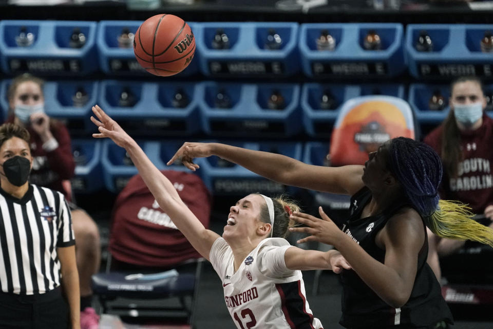 South Carolina forward Aliyah Boston, right, blocks a shot by Stanford guard Lexie Hull (12) during the first half of a women's Final Four NCAA college basketball tournament semifinal game Friday, April 2, 2021, at the Alamodome in San Antonio. (AP Photo/Morry Gash)