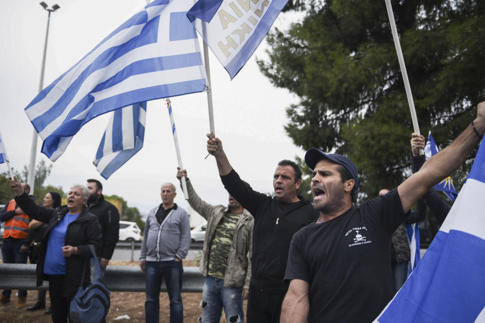 Greek protesters chant slogans against Greece's name deal with neighboring Macedonia, during a rally near Evzonoi border crossing in Greece, Sunday, Sept. 30, 2018. Macedonians were deciding on their country's future Sunday, voting whether to accept a landmark deal ending a decades-long dispute with neighboring Greece by changing their country's name to North Macedonia. (AP Photo/Giannis Papanikos)