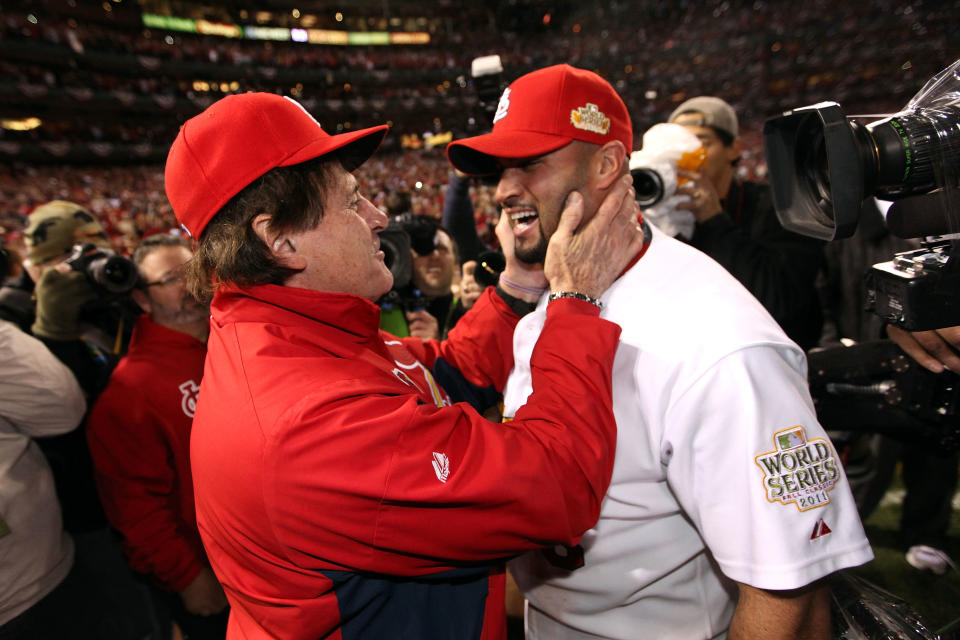 ST LOUIS, MO - OCTOBER 28: (L-R) Manager Tony La Russa and Albert Pujols #5 of the St. Louis Cardinals celebrate after defeating the Texas Rangers 6-2 to win the World Series in Game Seven of the MLB World Series at Busch Stadium on October 28, 2011 in St Louis, Missouri. (Photo by Jamie Squire/Getty Images)
