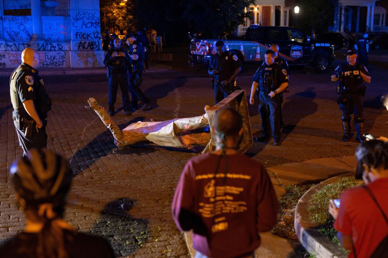 A statue of Confederate States President Jefferson Davis lies on the street after protesters pulled it down in Richmond, Va. on June 10, 2020.