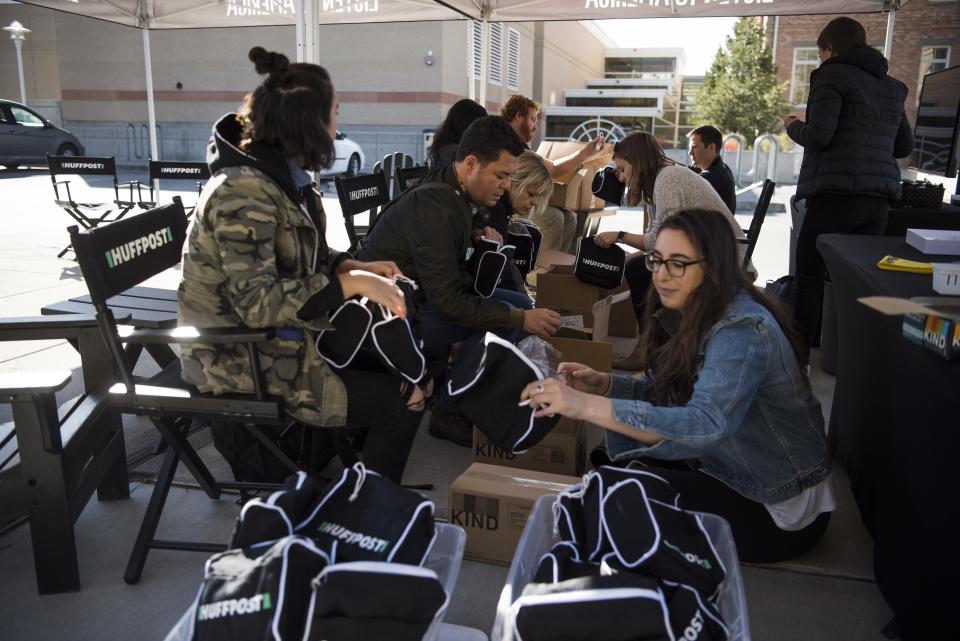 HuffPost and Peak XV staff put together swag bags before events get rolling in Provo.