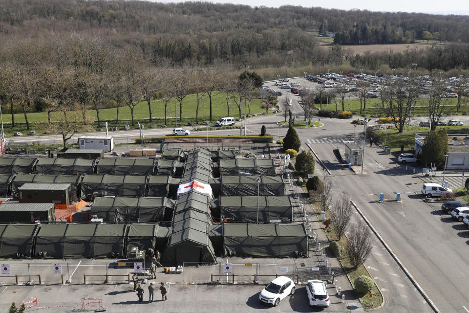 The military field hospital built in Mulhouse, eastern France, is pictured Monday March 23, 2020. The Grand Est region is now the epicenter of the outbreak in France, which has buried the third most virus victims in Europe, after Italy and Spain. For most people, the new coronavirus causes only mild or moderate symptoms. For some it can cause more severe illness. (AP Photo/Jean-Francois Badias)