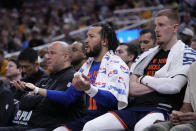 New York Knicks guard Jalen Brunson and guard Donte DiVincenzo, right, watch from the bench during the second half of Game 4 against the Indiana Pacers in an NBA basketball second-round playoff series, Sunday, May 12, 2024, in Indianapolis. (AP Photo/Michael Conroy)