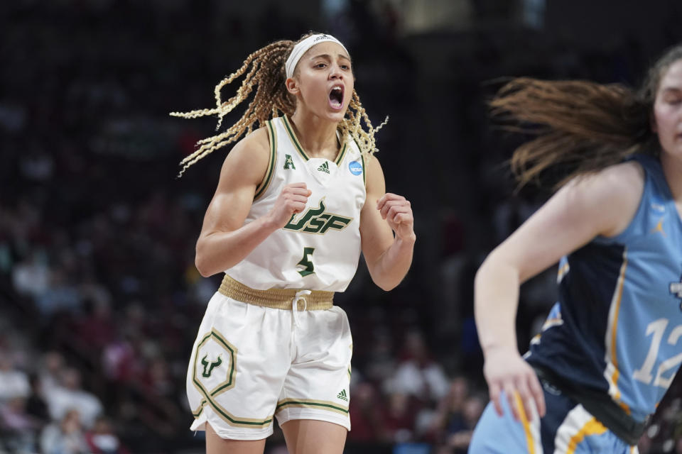 South Florida guard Elena Tsineke celebrates her go-ahead basket during overtime of a first-round college basketball game against Marquette in the NCAA Tournament, Friday, March 17, 2023, in Columbia, S.C. South Florida won 67-65. (AP Photo/Sean Rayford)