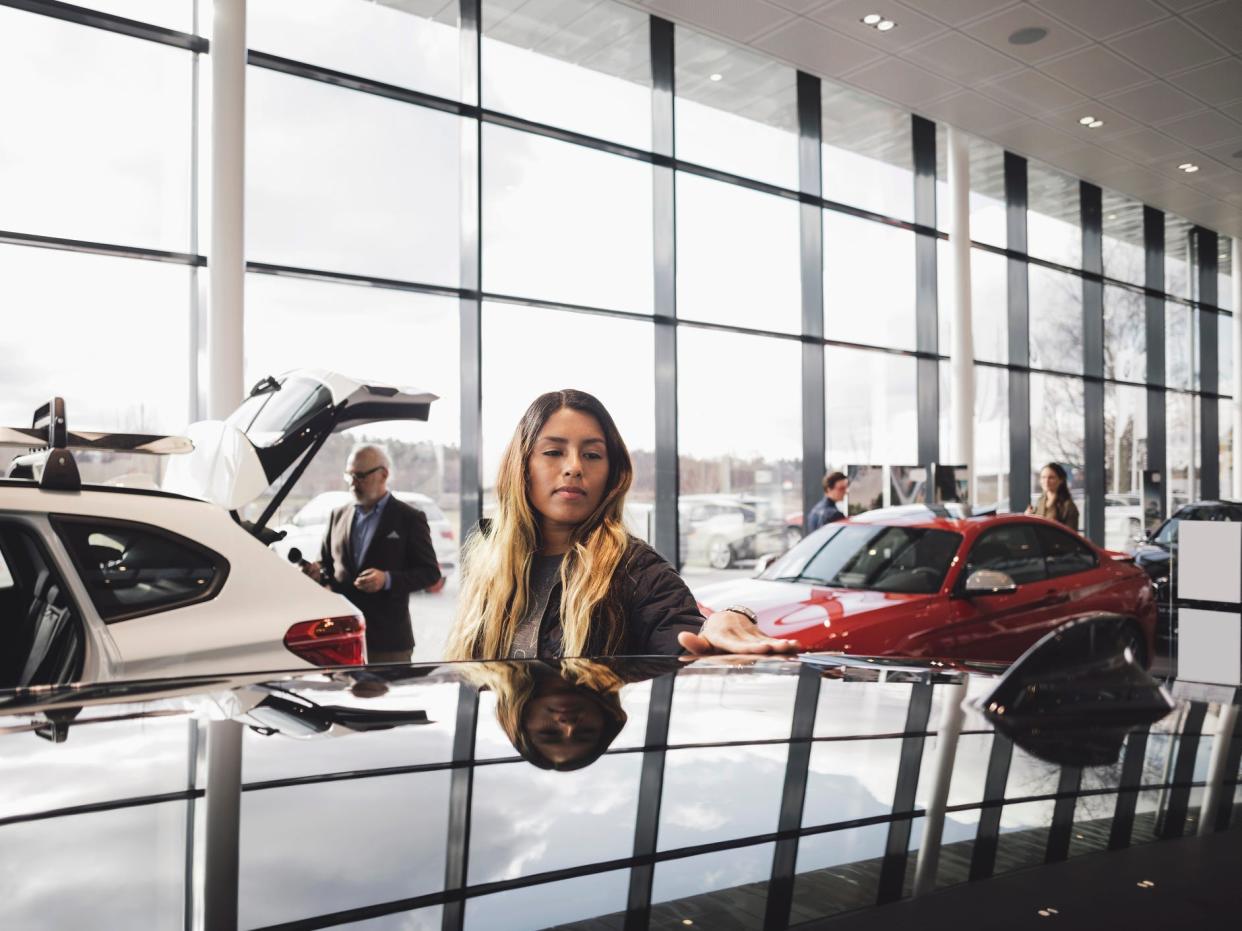 person shopping for a car at a dealership