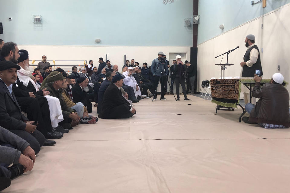 Muhammad Younus, the imam of the California Islamic Center, addresses mourners at the funeral service for 2-year-old Abdullah Hassan in Lodi, Calif., Saturday, Dec. 29, 2018. His mother, Shaima Swileh, from Yemen, successfully fought the Trump administration's travel ban to hold the dying boy again in the United States. (AP Photo/Daisy Nguyen)