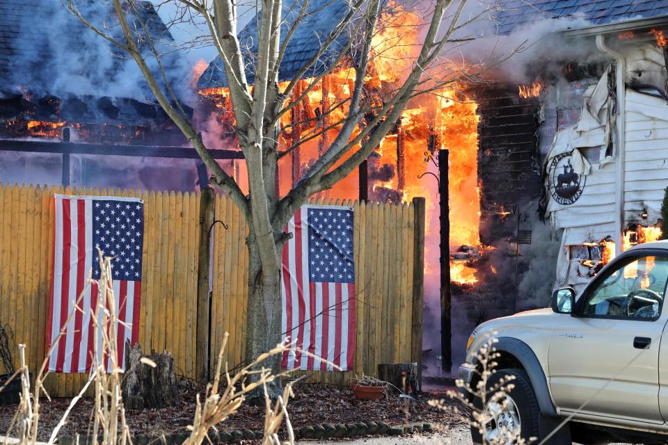 Firefighters from multiple communities battle a two-alarm house fire at 53 Old Bedford Road in East Bridgewater on Sunday, Feb. 4, 2024.