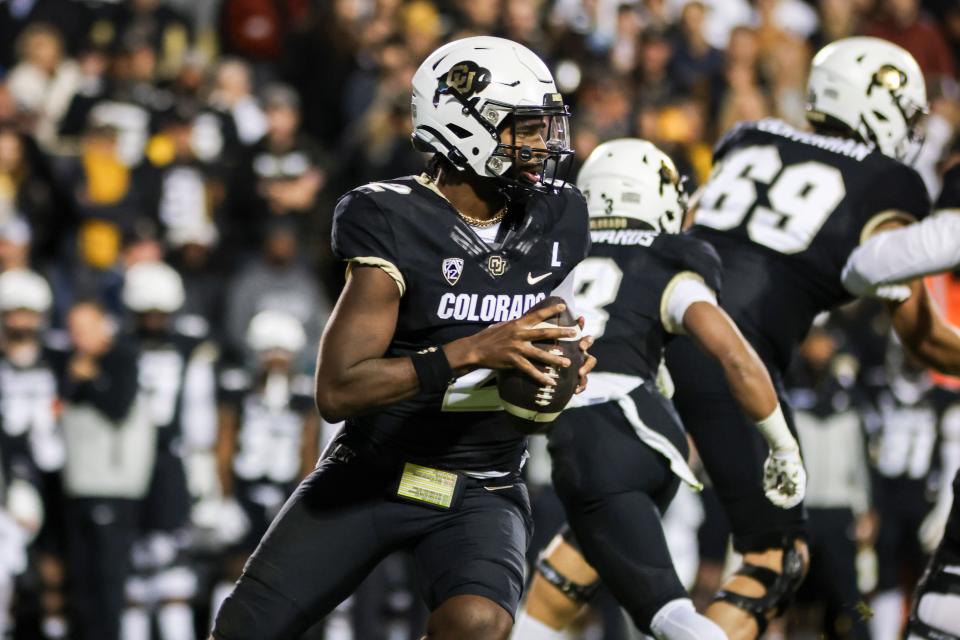 Colorado quarterback Shedeur Sanders (2) drops back for a pass against Oregon State during their game on Nov. 4, 2023.