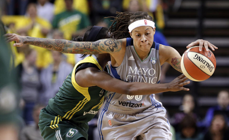 FILE - Seattle Storm's Jewell Loyd, left, fouls Minnesota Lynx's Seimone Augustus late in the second half of a WNBA basketball game Sunday, May 22, 2016, in Seattle. Augustus was elected to the Naismith Basketball Hall of Fame, Saturday, April 6, 2024. The 13-member class of 2024 will be enshrined into the Hall of Fame in Springfield, Massachusetts, in August,(AP Photo/Elaine Thompson)