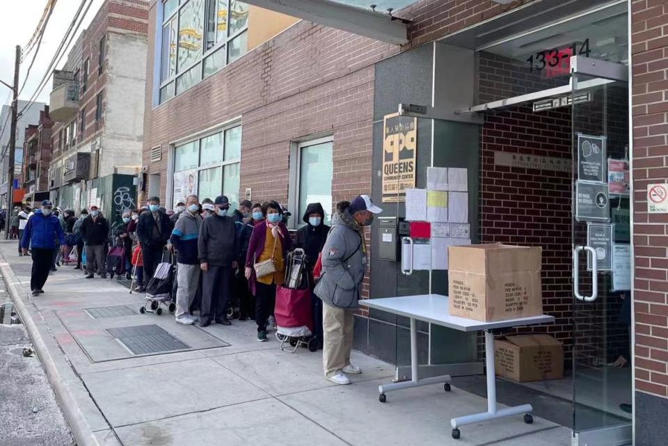 Image:  Asian seniors line up to get free safety alarms distributed by the nonprofit Asians in America in Flushing, N.Y., last month. (Courtesy Asians in America and the Chinese-American Planning Council)