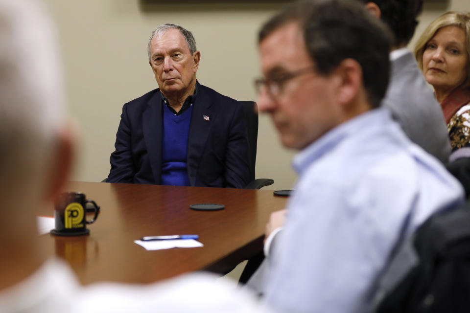 Former New York Mayor Michael Bloomberg, center, participates in a roundtable discussion at the Paulson Electric Company, Tuesday, Dec. 4, 2018, in Cedar Rapids, Iowa. (AP Photo/Charlie Neibergall)