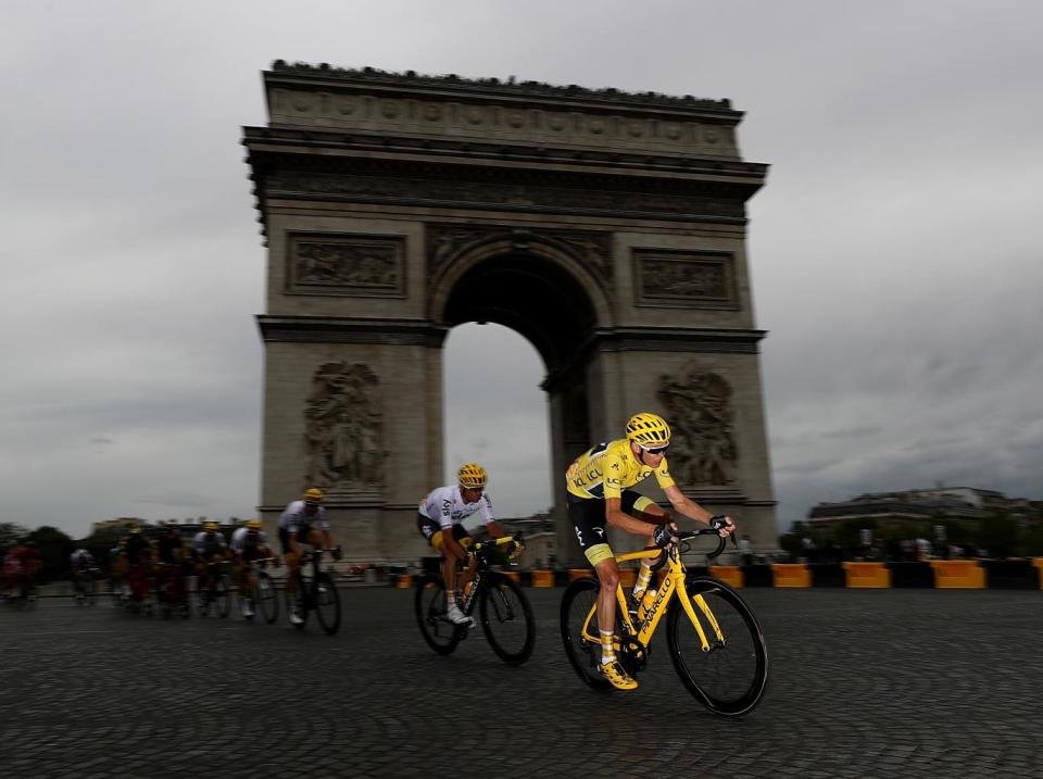 Froome cycling past the Champs-Élysées (Getty)