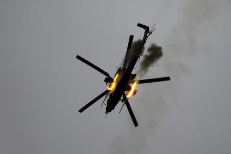 An Iraqi Air Force helicopter fires missiles against Islamic State militants during a battle in Mosul, Iraq March 19, 2017. REUTERS/Thaier Al-Sudani