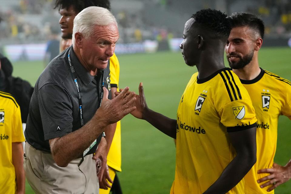 Columbus Crew owner Jimmy Haslam talks to midfielder Yaw Yeboah following their 3-0 win over FC Cincinnati in the MLS soccer match at Lower.com Field on Aug. 20.