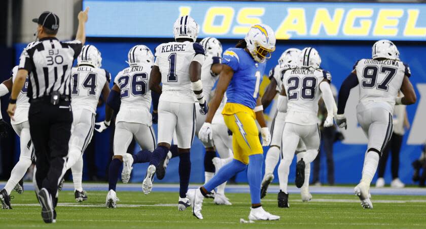 Los Angeles, CA - October 16: Los Angeles Chargers Quentin Johnston walk to the sidelines after the Dallas Cowboys intercepted a pass in the final minutes of their contest at SoFi Stadium on Monday, Oct. 16, 2023, in Los Angeles, CA. (Robert Gauthier / Los Angeles Times)