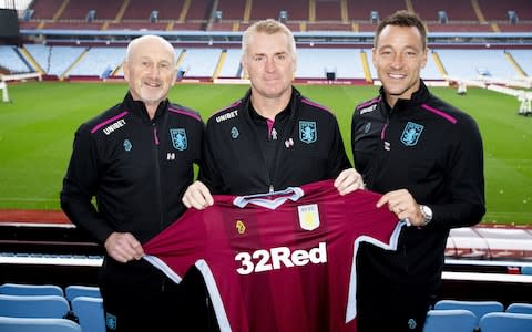 Dean Smith (centre) with assistants Richard O'Kelly (left) and John Terry (right) - Credit: getty images