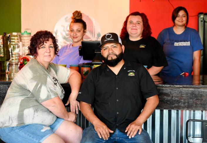 Owners Antonio and Melissa Estrada with their daughter Brianna, back row center, with employees Stephanie Velazquez, left, and Kailey Patterson at the new Tacos El Jefe Mexican Restaurant in Fort Valley. The couple started with a food truck, then a walk-up restaurant in the Houston County Galleria in Centerville, and now they’re gearing up to open their dine-in restaurant in Fort Valley.