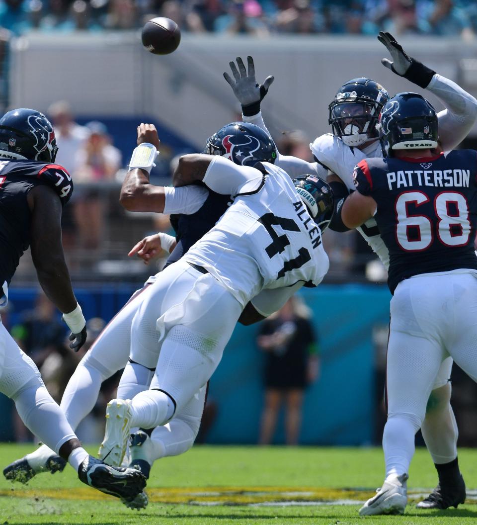 Josh Allen (41), seen here pressuring Houston Texans quarterback C.J. Stroud from behind, has been the Jacksonville Jaguars' best pass-rusher this season, but the Jaguars aren't doing enough to get opposing quarterbacks on the ground with just five sacks in three games.