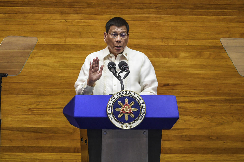 Philippine President Rodrigo Duterte gestures as he delivers his final State of the Nation Address at the House of Representatives in Quezon City, Philippines on Monday, July 26, 2021. Duterte delivered his final State of the Nation speech Monday before Congress, winding down his six-year term amid a raging pandemic, a battered economy and a legacy overshadowed by a bloody anti-drug crackdown that set off complaints of mass murder before the International Criminal Court. (Jam Sta Rosa/Pool Photo via AP)