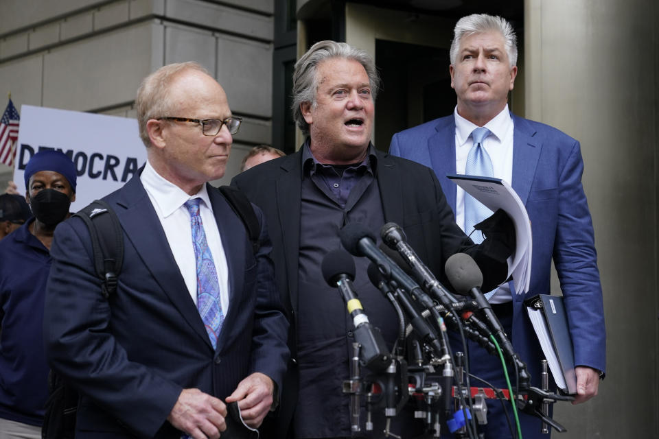 Former White House strategist Steve Bannon, center, speaks with members of the press after departing the federal court, Monday, July 18, 2022, in Washington. Standing with Bannon are his attorneys David Schoen, left, and M. Evan Corcoran. Jury selection began Monday in the trial of Bannon, a one-time adviser to former President Donald Trump, who faces criminal contempt of Congress charges after refusing for months to cooperate with the House committee investigating the Jan. 6, 2021, Capitol insurrection. (AP Photo/Patrick Semansky)