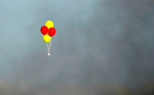 Balloons loaded with incendiaries are flown towards Israel during a confrontation between Palestinian demonstrators and Israeli troops east of Gaza City, along the border between the Gaza strip and Israel, on July 13, 2018