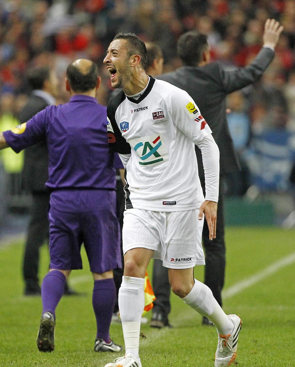 Guingamp player Jonathan Martins Pereira celebrates scoring the first goal for his team during the French Cup final match between Guingamp and Rennes at the Stade de France Stadium, in Saint Denis, North of Paris, Saturday May 3, 2014. (AP Photo/Remy de la Mauviniere)