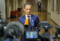 German Foreign Minister Heiko Maas speaks to the media after a meeting on divisive migrant issue in Paris, France, July 22, 2109. European ministers are meeting in Paris in a new step to find an accord on the divisive issue of how to deal with migrants crossing the Mediterranean but, shut out by Italy and unwanted elsewhere, caught in political standoffs. (AP Photo/Michel Euler)