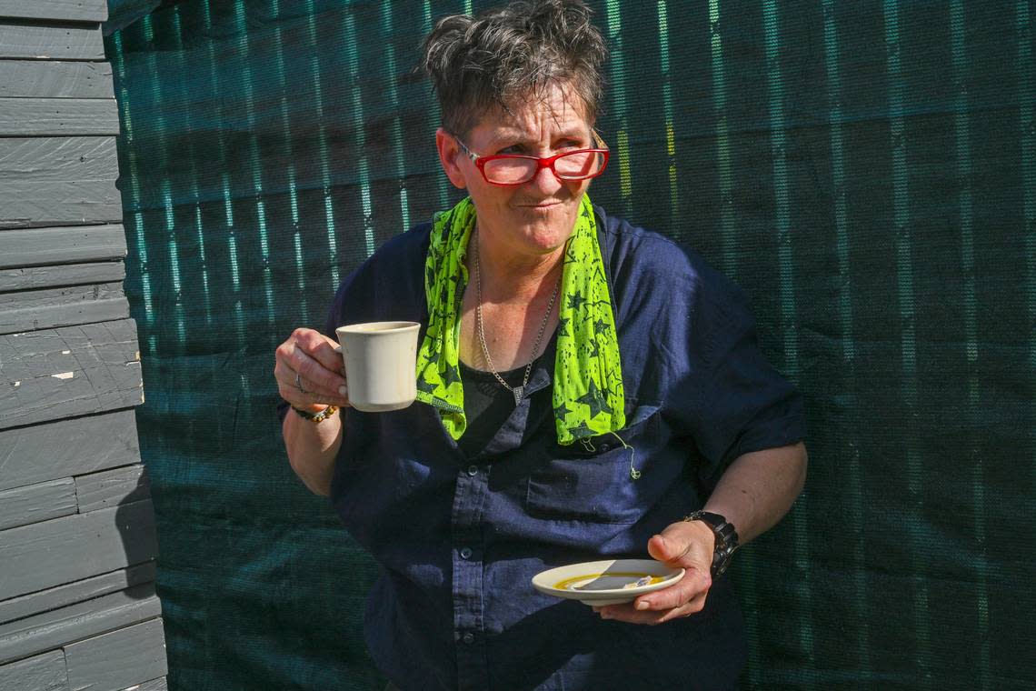 Joyce Williams drinks her coffee, with a cup and saucer the way her grandmother taught her, at Camp Resolution. It was the third cup of the day for Jones, who said she is constantly drained by emotional stress. That morning she and other encampment residents spoke at a state Senate committee hearing against SB 1011, which would criminalize homeless encampments. The bill was voted down.
