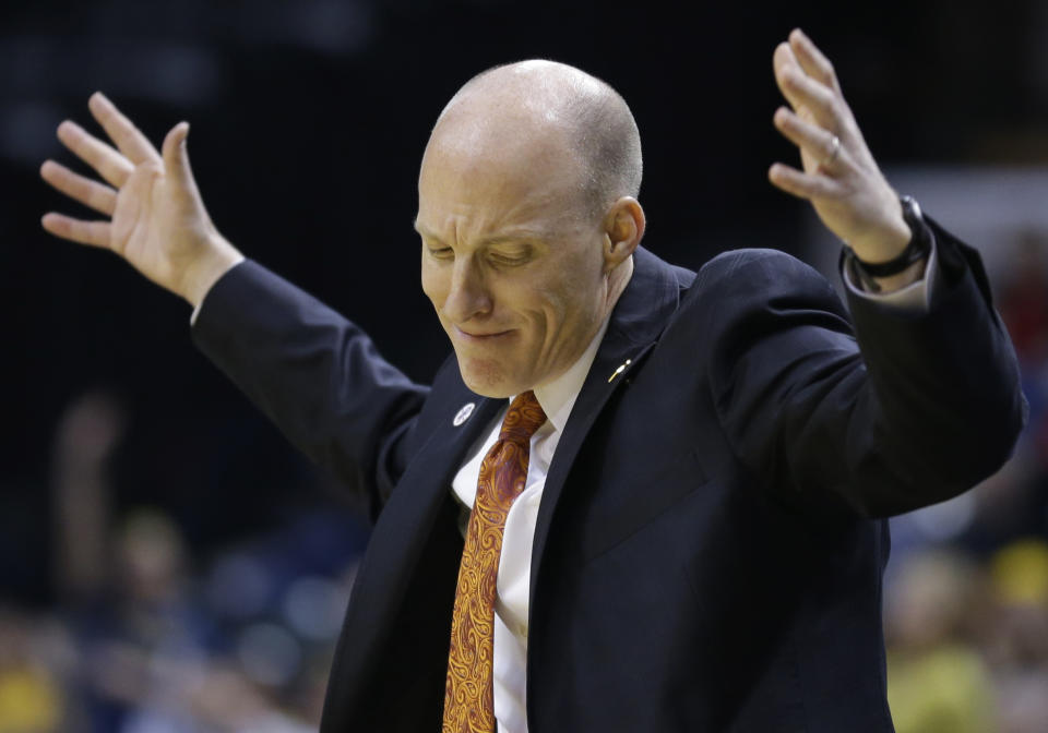 Illinois head coach John Groce reacts to a play in the first half of an NCAA college basketball game against Michigan in the quarterfinals of the Big Ten Conference tournament Friday, March 14, 2014, in Indianapolis. (AP Photo/Michael Conroy)